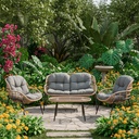 Sala para jardín con ratán redondo café y cojín confort